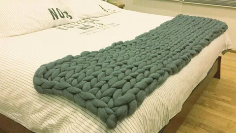 Manta de lana merino natural en tonos terracota y crema